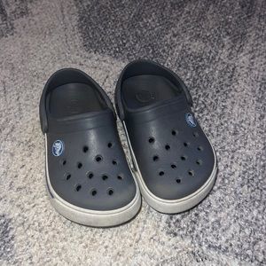 Used grey crocs
